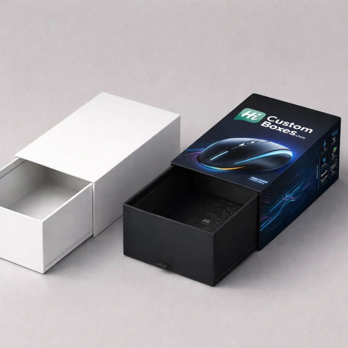 Two sleek drawer-style slide boxes, one plain white and one branded with a blue gaming mouse. class=